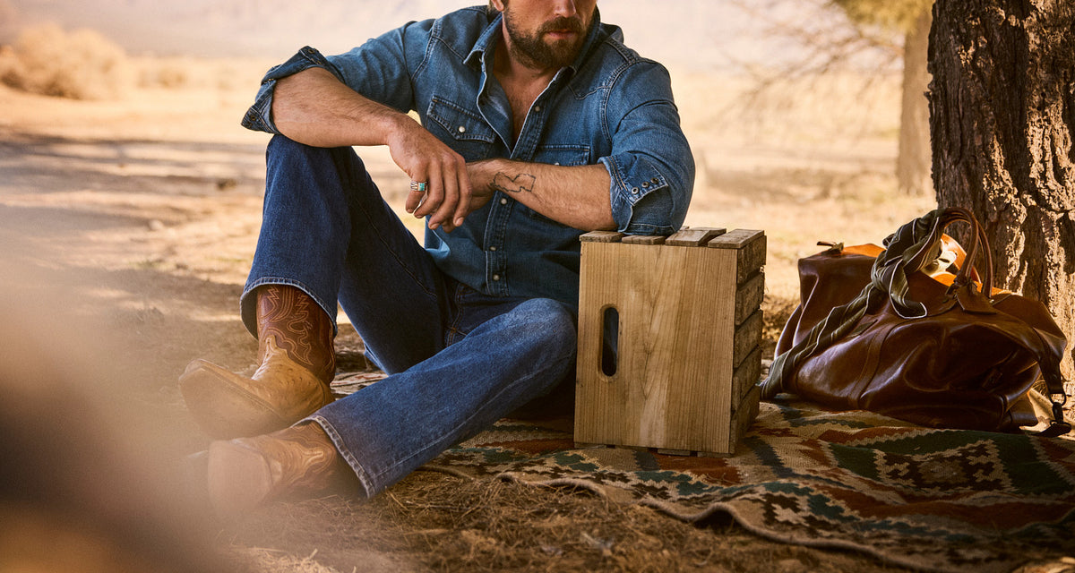 Luke Barnwood + Tan — on-model, seated desert, hero 15
